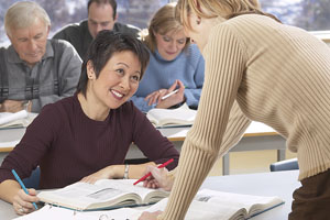 Adult woman getting help from teacher