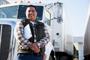 man standing in front of a large truck